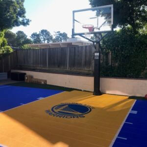 Backyard Basketball Court with Warriors Logo